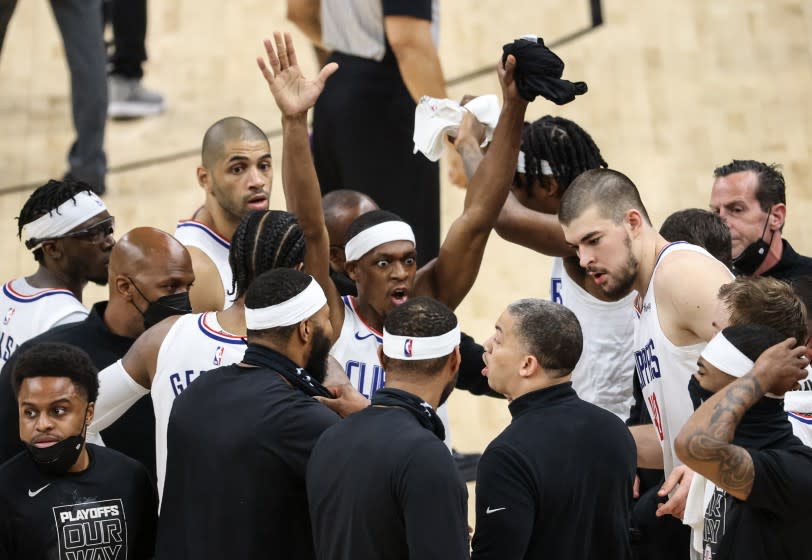 Tuesday, June 22, 2021, Phoenix, Arizona - LA Clippers guard Rajon Rondo (4) vehemently reminds his teammates to raise their hands on defense before losing to Phoenix on an alley-oop dunk with less than a second left in Game two of the NBA Western Conference Finals at Phoenix Suns Arena. (Robert Gauthier/Los Angeles Times)