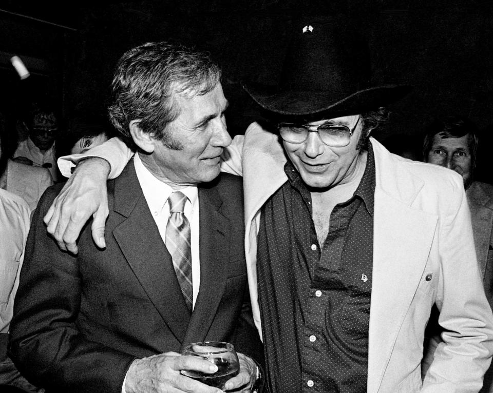 Bobby Bare, right, talks with Chet Atkins during a gala party at the Country Music Hall of Fame and Museum April 27, 1983, to honor Atkins for his 115th album release. His newest Columbia LP is "Work ItT Out With Chet."