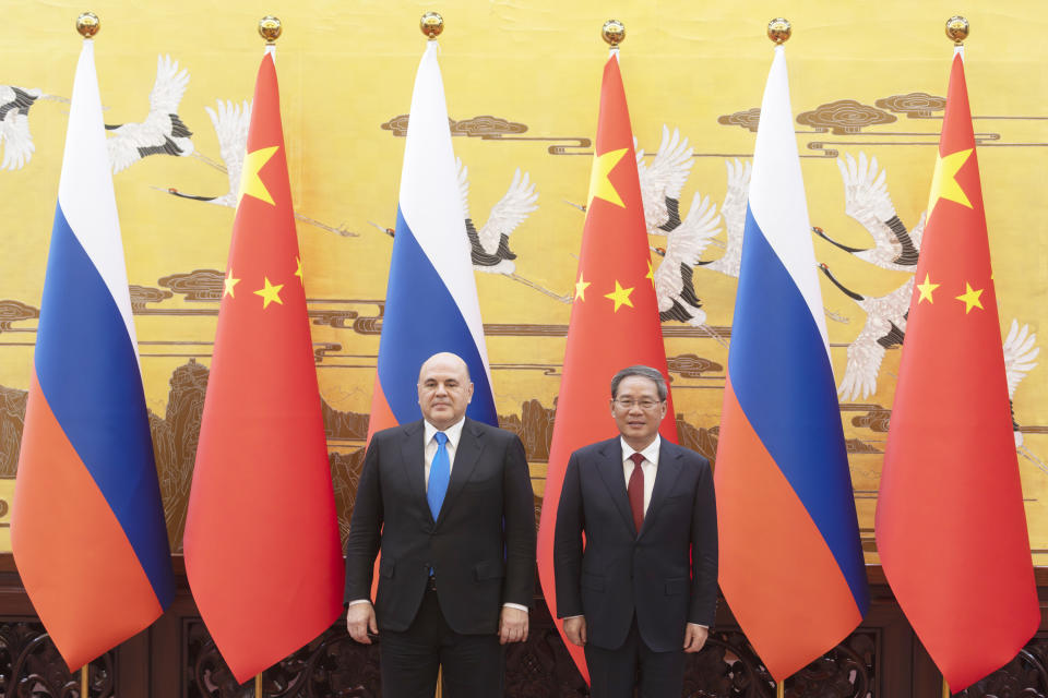 Russian Prime Minister Mikhail Mishustin and Chinese Premier Li Qiang attend a signing ceremony in Beijing, China, Wednesday, May 24, 2023. (Thomas Peter/Pool Photo via AP)