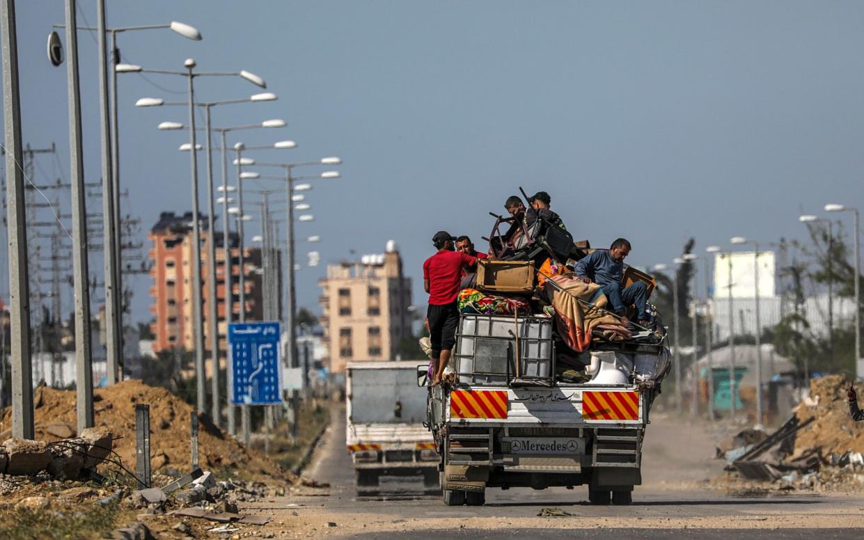 Palestinians leave with their belongings following an evacuation order issued by the Israeli army in Rafah