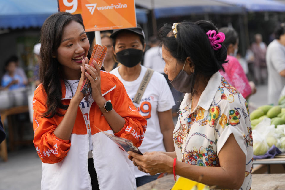 Prospective lawmaker for Move Forward Party Chonthicha Jangrew, left, introduces herself during an election campaign in Pathum Thani province, north of Bangkok, Thailand, April 17, 2023. Three years ago, tens of thousands of mostly young people in Thailand took to the streets in heated demonstrations seeking democratic reforms. Now, with a general election coming in three weeks, leaders of the country’s progressive movement are hoping to channel the same radical spirit for change though the ballot box. (AP Photo/Sakchai Lalit)