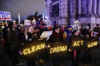 <p>Protestors gather at Grand Army Plaza near the home of Sen. Charles Schumer, D-N.Y Tuesday, Jan. 23, 2018, in New York. (Photo: Frank Franklin II/AP) </p>