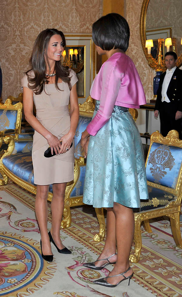 <div class="caption-credit"> Photo by: Getty</div>What do you wear to meet the FLOTUS on the President's official trip to London? Kate went with a fitted flesh-toned Reiss dress (enhancing her honeymoon tan) and carried an Anya Hindmarch Maud clutch. <br>
