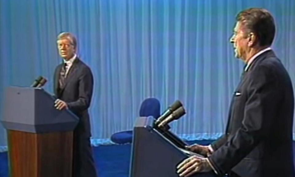 Jimmy Carter and Ronald Reagan during a debate in 1980.