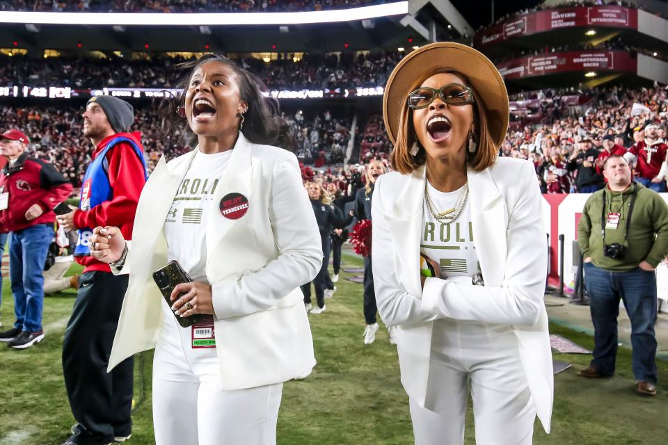 Nov 19, 2022; Columbia, South Carolina, USA;  University of South Carolina director of on-campus recruiting Jessica Jackson, left, and assistant director of on-campus recruiting Jasmin Moses cheer the Gamecocks during their upset win over the Tennessee Volunteers in the second half at Williams-Brice Stadium. Mandatory Credit: Jeff Blake-USA TODAY Sports