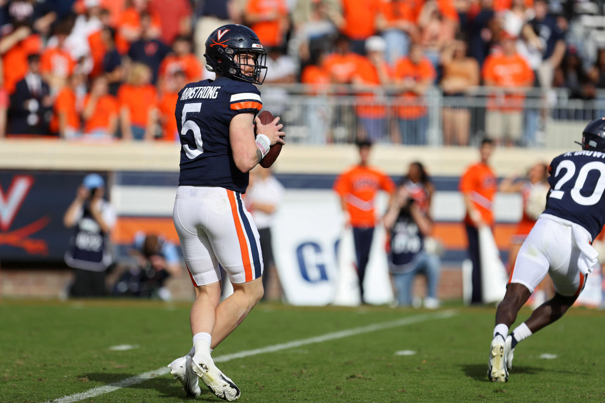 CHARLOTTESVILLE, VA - NOVEMBER 05: Brennan Armstrong #5 of the Virginia Cavaliers drops back in the second half during a game against the North Carolina Tar Heels at Scott Stadium on November 5, 2022 in Charlottesville, Virginia. (Photo by Ryan M. Kelly/Getty Images)