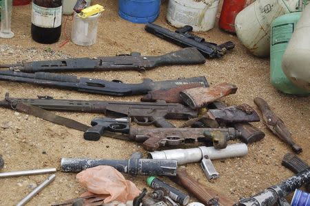Confiscated weapons are displayed after a Nigerian military raid on a hideout of suspected Islamist Boko Haram members in Nigeria's northern city of Kano in this August 11, 2012 file photo. REUTERS/Stringer/Files