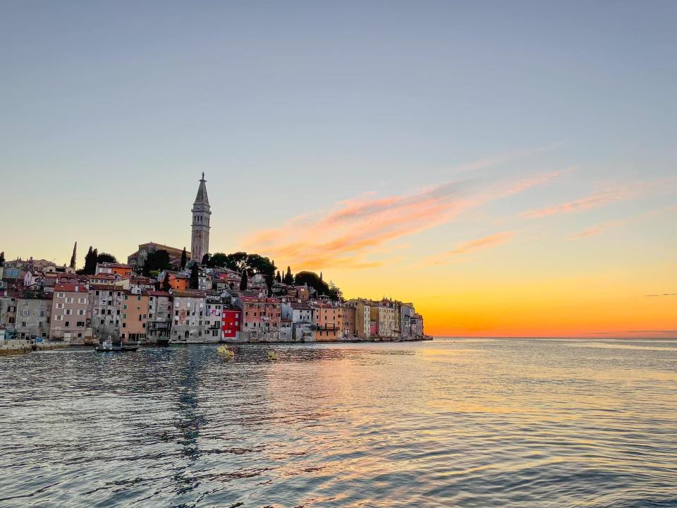 The coast of a city at sunset.