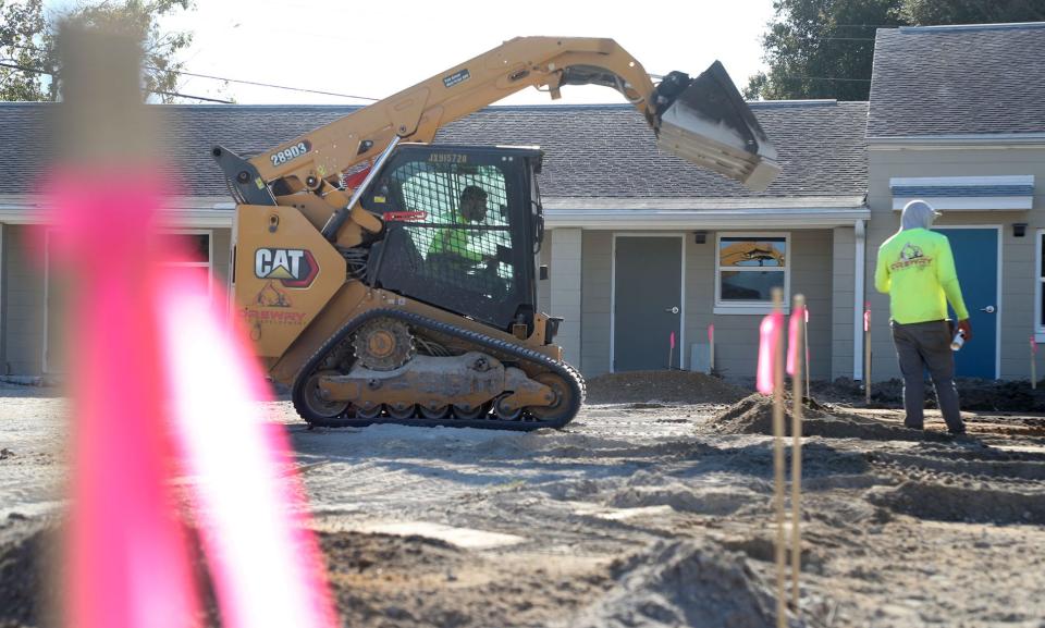 A 70-year-old church property in Daytona Beach's Derbyshire neighborhood has been transformed into a transitional housing facility for veterans. The new Barracks of Hope shelter will hold its grand opening Nov. 10. Pictured are workers leveling the ground on Oct. 31.