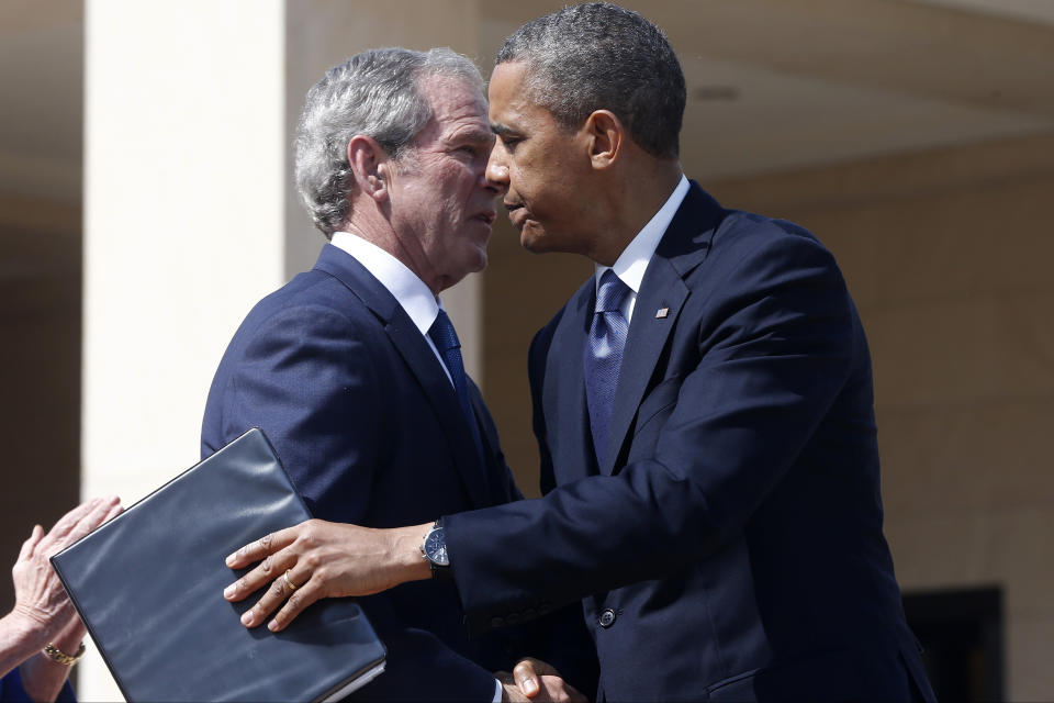 President Barack Obama embraces former President George W. Bush after he spoke at the dedication of the George W. Bush presidential library on the campus of Southern Methodist University in Dallas, Thursday, April 25, 2013. (AP Photo/Charles Dharapak)