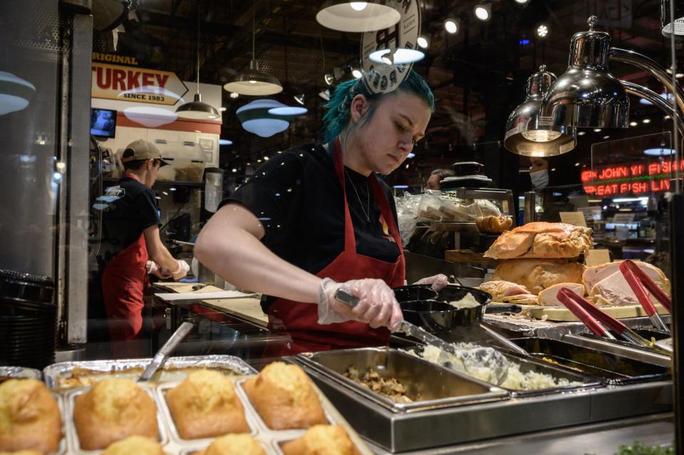 A general view shows diners and vendors at the Reading Terminal Market in Philadelphia on May 23, 2022. (Photo by Ed JONES / AFP)