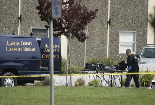 A police officer carries the body of a victim at a private religious college in Oakland, California. Seven people were killed Monday in a shooting at a private religious college near San Francisco, the head of the local city council said