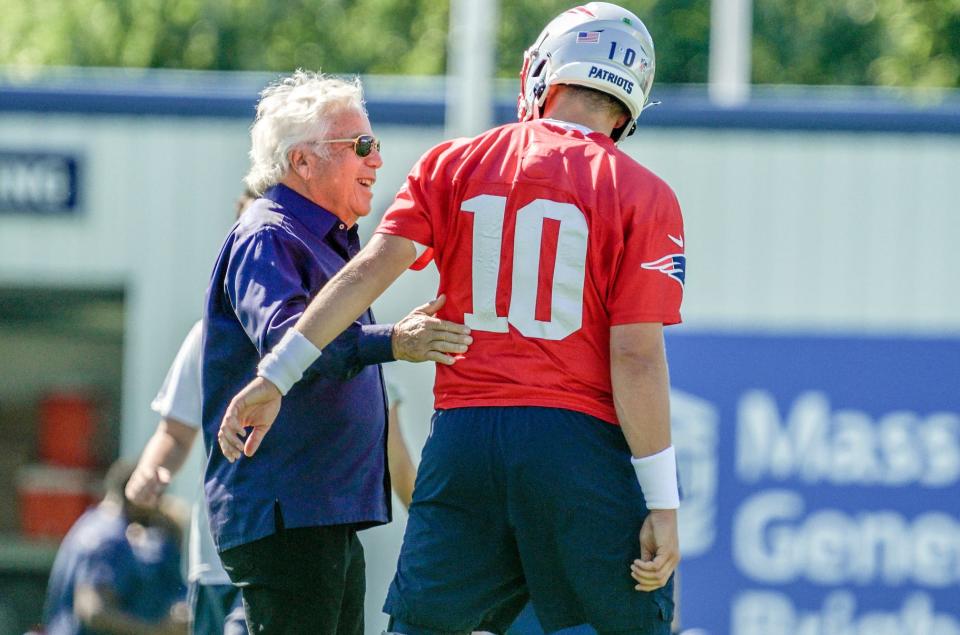 Patriots owner Robert Kraft greets quarterback Mac Jones on Wednesday, the first day of training camp at Gillette Stadium in Foxboro. Full coverage in Sports, 1B.