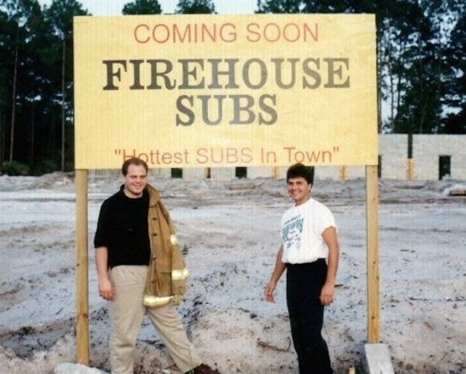 Robin Sorensen & Chris Sorensen in front of first location 