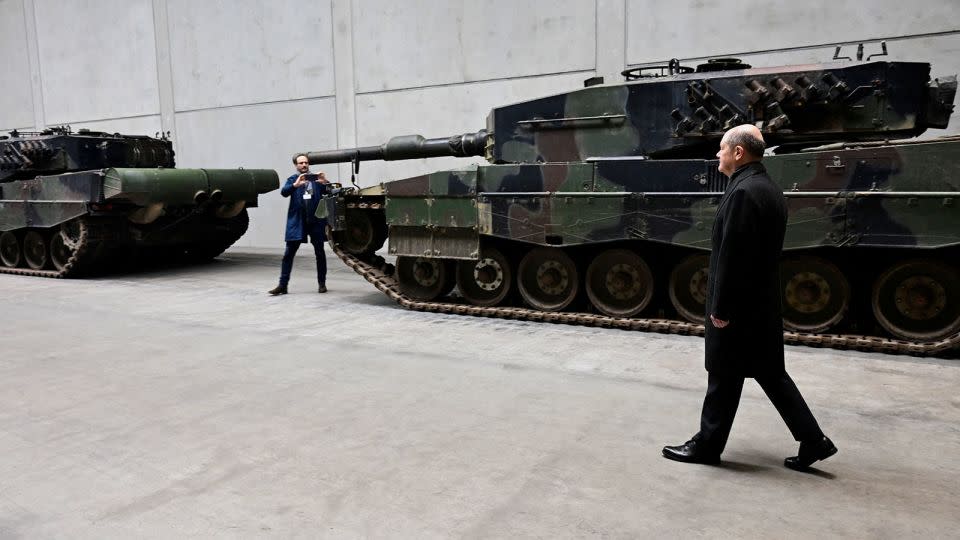 German Chancellor Olaf Scholz visits the future site of an arms factory where weapons maker Rheinmetall plans to produce munitions from 2025, in Unterluess, Germany, on February 12, 2024. - Fabian Bimmer/Pool/Reuters