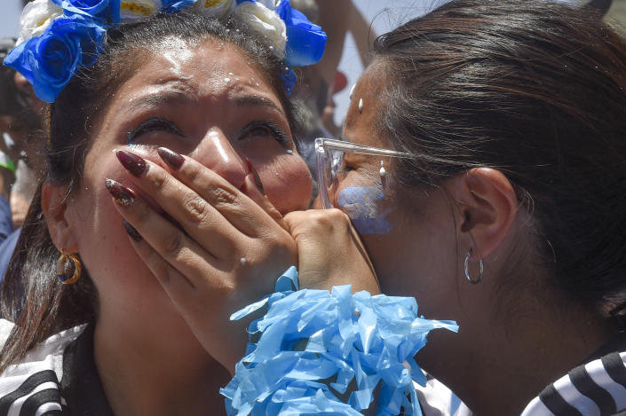 Argentine soccer fans celebrate their team's opening goal during the World Cup final soccer match between Argentina and France in Buenos Aires, Argentina, Sunday, Dec. 18, 2022. (AP Photo/Gustavo Garello)