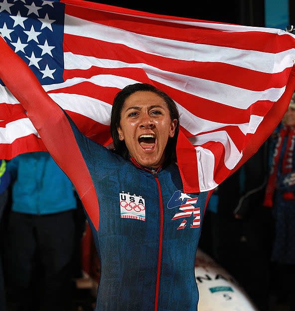 Elana holding up a flag