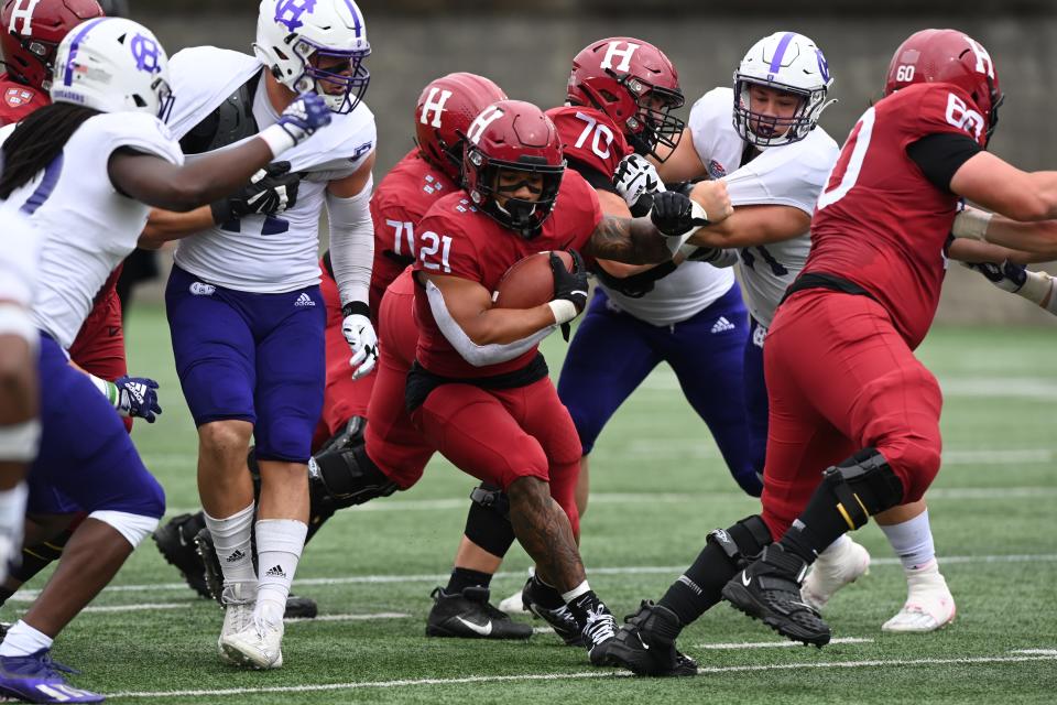 Harvard running back Aidan Borguet carries the ball against Holy Cross on Oct. 1. Borguet may hear his name called during the 2023 NFL Draft.
