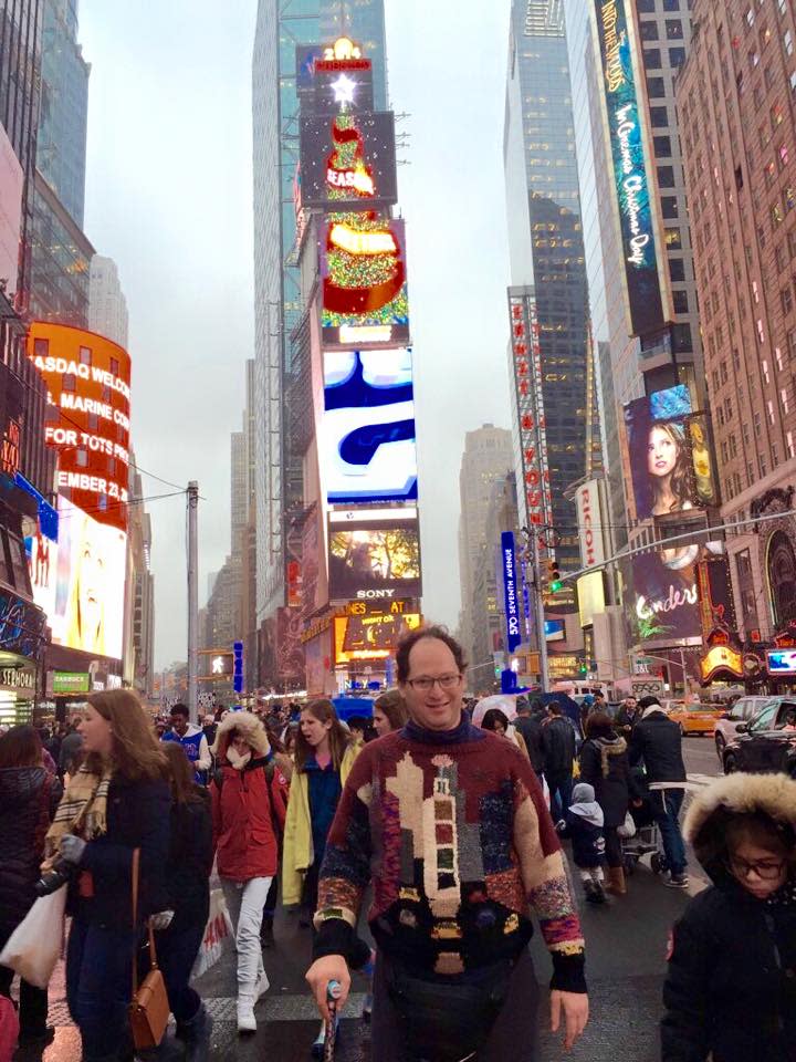 Sam Barsky shows off his handmade Times Square sweater... in Times Square. (Photo: Facebook)