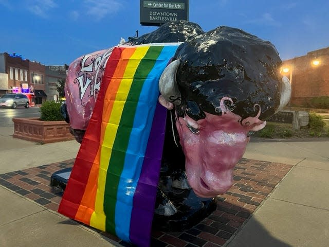 The bison at Frank Phillips Boulevard and Dewey Avenue is covered with a rainbow flag in honor of 2023 Bartlesville Pride.
