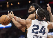 Memphis Grizzlies' Lamar Stevens (24) blocks Cleveland Cavaliers' Jarrett Allen during the first half of an NBA basketball game in Cleveland, Wednesday, April 10, 2024. (AP Photo/Phil Long)