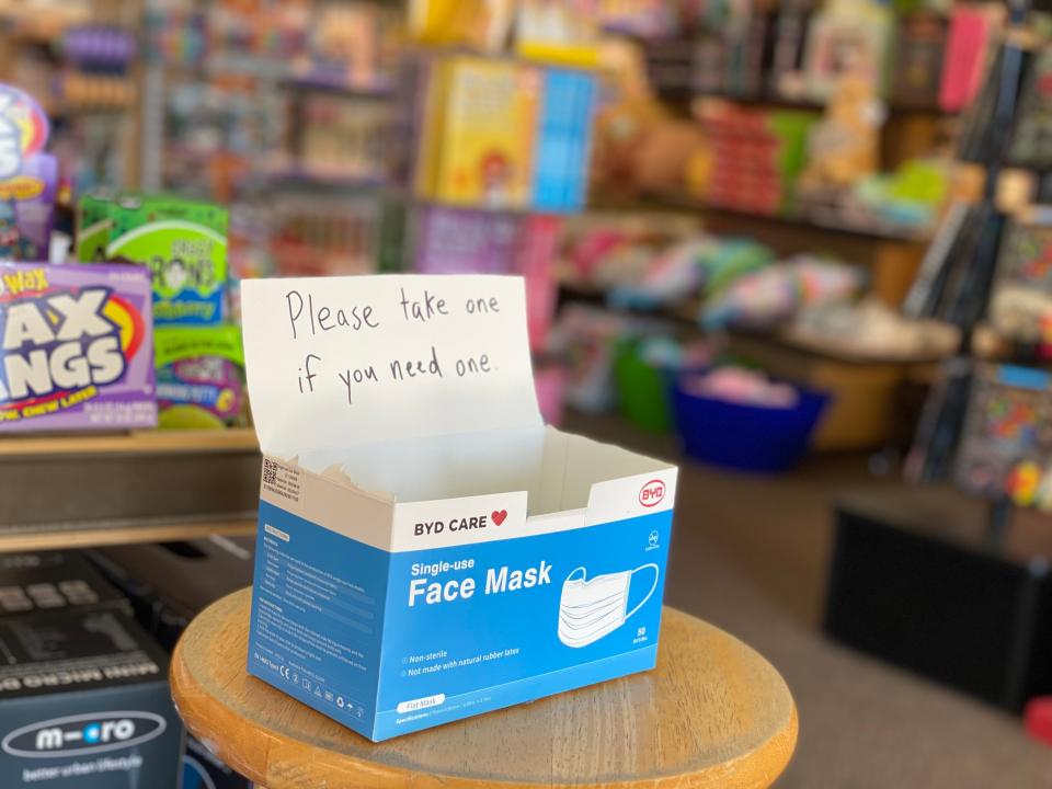 Turner Toys in Essex offers masks to customers on Oct. 13, 2021 as it required masks to be worn in its store regardless of vaccination status.