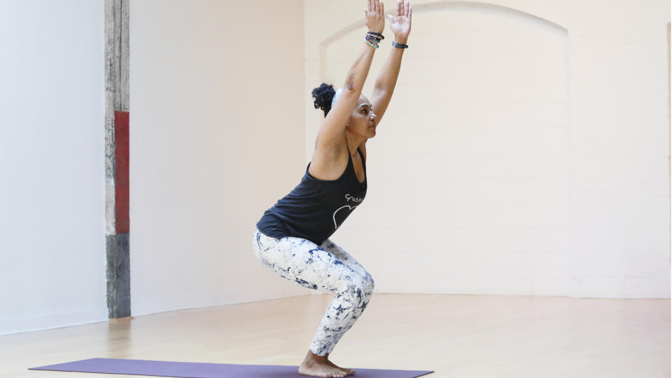 Woman demonstrating chair pose