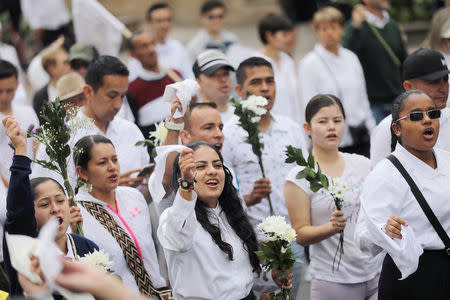 People take part in a rally against violence, following a car bomb explosion, in Bogota, Colombia January 20, 2019. REUTERS/Luisa Gonzalez