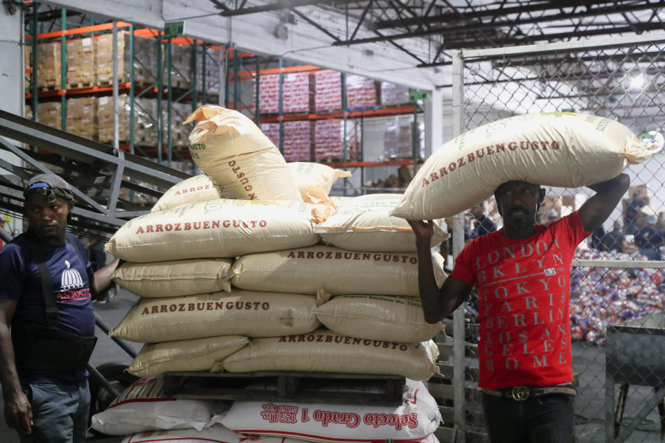 <p>Workers of the Social State Plan prepare food rations in preparation for Hurricane Fiona in Santo Domingo, Dominican Republic, September 18, 2022. REUTERS/Ricardo Rojas</p> 