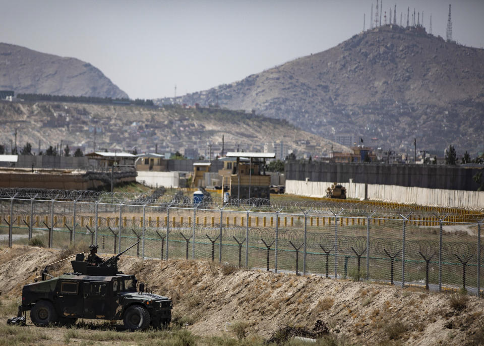 In this image provided by the Department of Defense, paratroopers assigned to the 1st Brigade Combat Team, 82nd Airborne Division, conduct security as they continue to help facilitate evacuations at Hamid Karzai International Airport in Kabul, Afghanistan, Wednesday, Aug 25, 2021. (Department of Defense via AP)