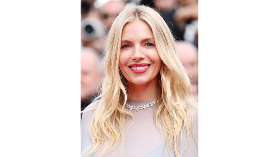 Sienna Miller wearing a blue frill-lined gown at Cannes Film Festival