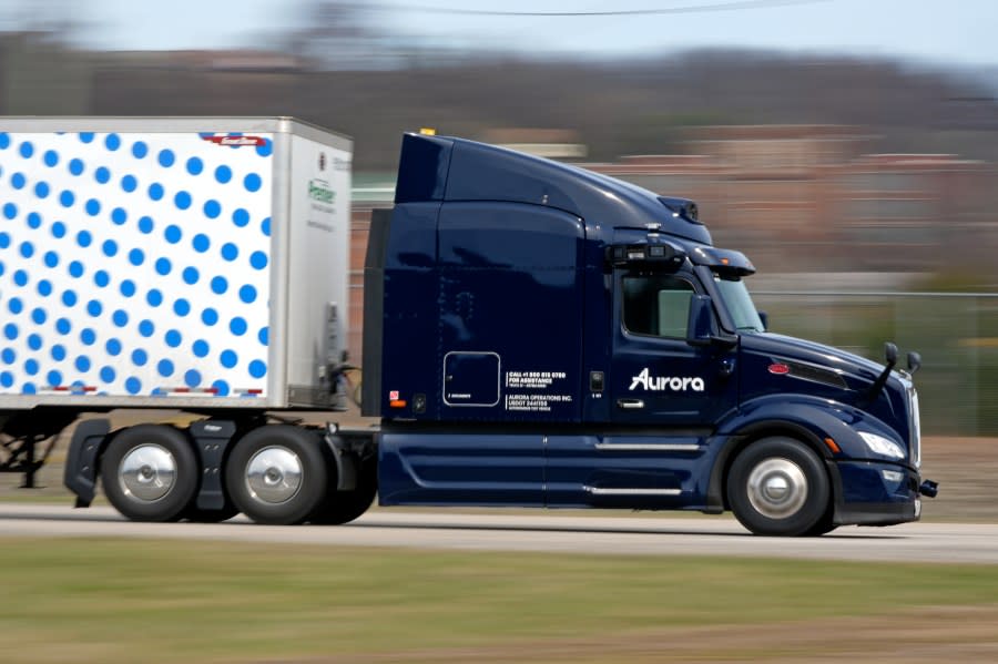 A self-driving tractor trailer maneuvers around a test track in Pittsburgh, Thursday, March 14, 2024. The truck is owned by Pittsburgh-based Aurora Innovation Inc. Late this year, Aurora plans to start hauling freight on Interstate 45 between the Dallas and Houston areas with 20 driverless trucks. (AP Photo/Gene J. Puskar)