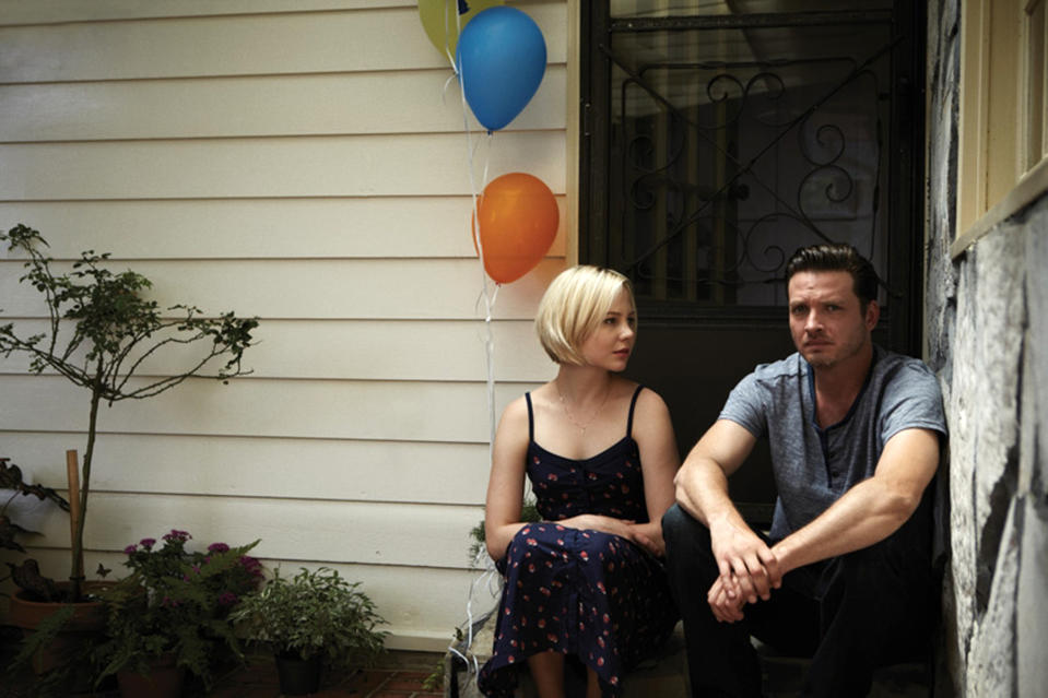 This publicity image released by the Sundance Channel shows Adelaide Clemens, left, and Aden Young in a scene from the drama series "Rectify." The six-hour miniseries, whose first two hours air on Sundance Channel on Monday at 9 p.m., tells a unique story about a man who was caged for two decades for the rape and murder of his teenage girlfriend. Then, when his conviction is vacated thanks to new DNA evidence, he is restored to an outside world that proves just as harrowing. (AP Photo/Sundance Channel)