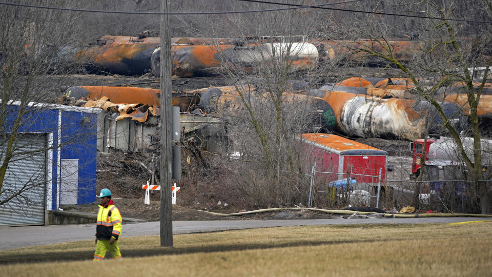 FILE - The cleanup of portions of a Norfolk Southern freight train that derailed Friday night in East Palestine, Ohio, continues on Feb. 9, 2023. After the catastrophic train car derailment in East Palestine, Ohio, some officials are raising concerns about a type of toxic substance that tends to stay in the environment. (AP Photo/Gene J. Puskar, File)