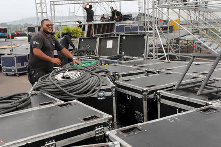 Workers set up a platform for the upcoming concert "Venezuela Aid Live" at Tienditas cross-border bridge between Colombia and Venezuela in Cucuta, Colombia February 20, 2019. REUTERS/Luisa Gonzalez