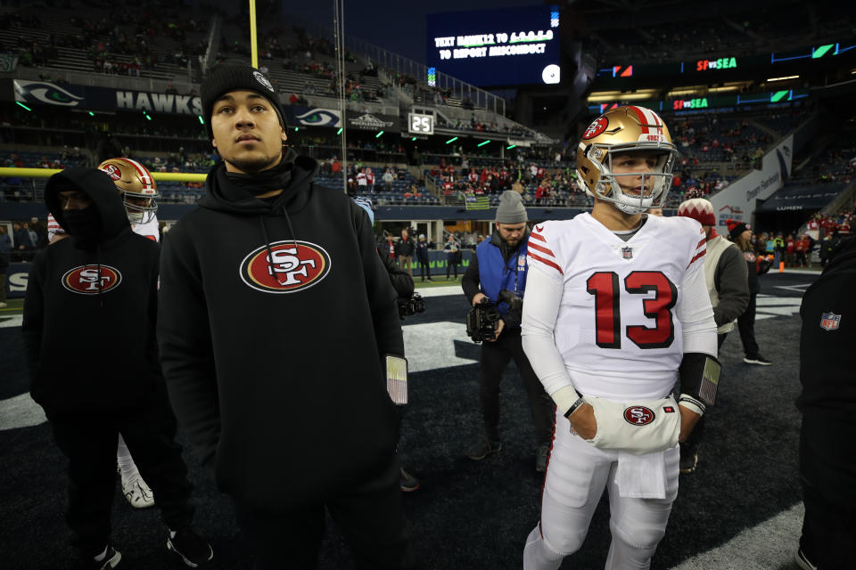 Trey Lance (left) and Brock Purdy (right) will likely compete for the 49ers starting quarterback job in 2023. (Photo by Michael Zagaris/San Francisco 49ers/Getty Images)