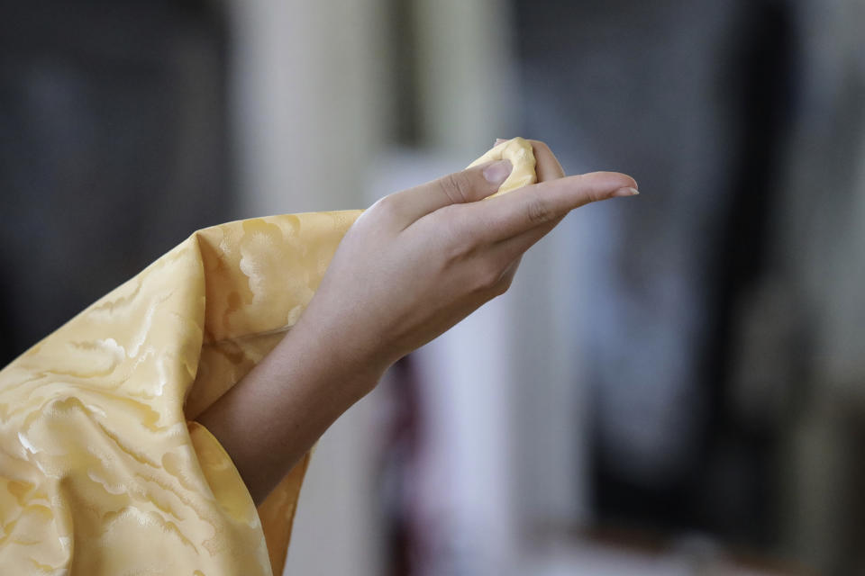 Aimi Kawasaki practices her Japanese traditional Hanayagi-style dance movements in the studio of Professor Naoko Kihara, in Mexico City, Friday, Nov. 24, 2023. Japanese dances as Hanayagi and Kabuki have been historically performed to honor the emperor, considered a representative of god in the Shinto religion. (AP Photo/Ginnette Riquelme)