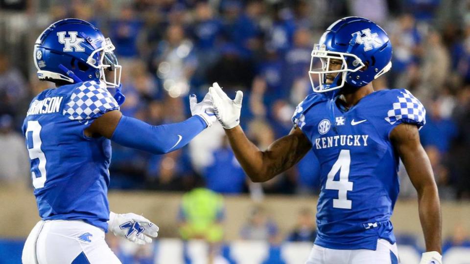 Kentucky Wildcats wide receiver Tayvion Robinson (9), left, celebrates a fourth quarter touchdown with Kentucky Wildcats wide receiver DeMarcus Harris (4) during football game against Northern Illinois at Kroger Field in Lexington, Ky., Saturday, Sept. 24, 2022.