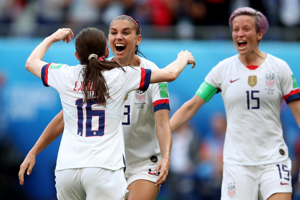 LYON, FRANCE - JULY 07: Rose Lavelle celebrates scoring their 2nd goal with Alex Morgan and Megan Rapinoe of USA during the 2019 FIFA Women's World Cup France Final match between The United States of America and The Netherlands at Stade de Lyon on July 7, 2019 in Lyon, France. (Photo by Marc Atkins/Getty Images)