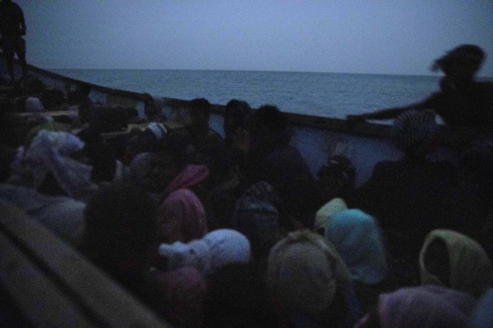 In this July 15, 2019 photo, smugglers ferry Ethiopian migrants in a boat at the uninhabited coast outside the town of Obock, the shore closest to Yemen, in Djibouti. According to the U.N.'s International Organization for Migration the number of women making the trip jumped from nearly 15,000 in 2018 to more than 22,000 in 2019. The number of girls had an enormous increase, quadrupling from 2,075 to 8,360. Despite the many risks – smugglers' exploitation, rape, hunger, drowning – they are undaunted. (AP Photo/Nariman El-Mofty)