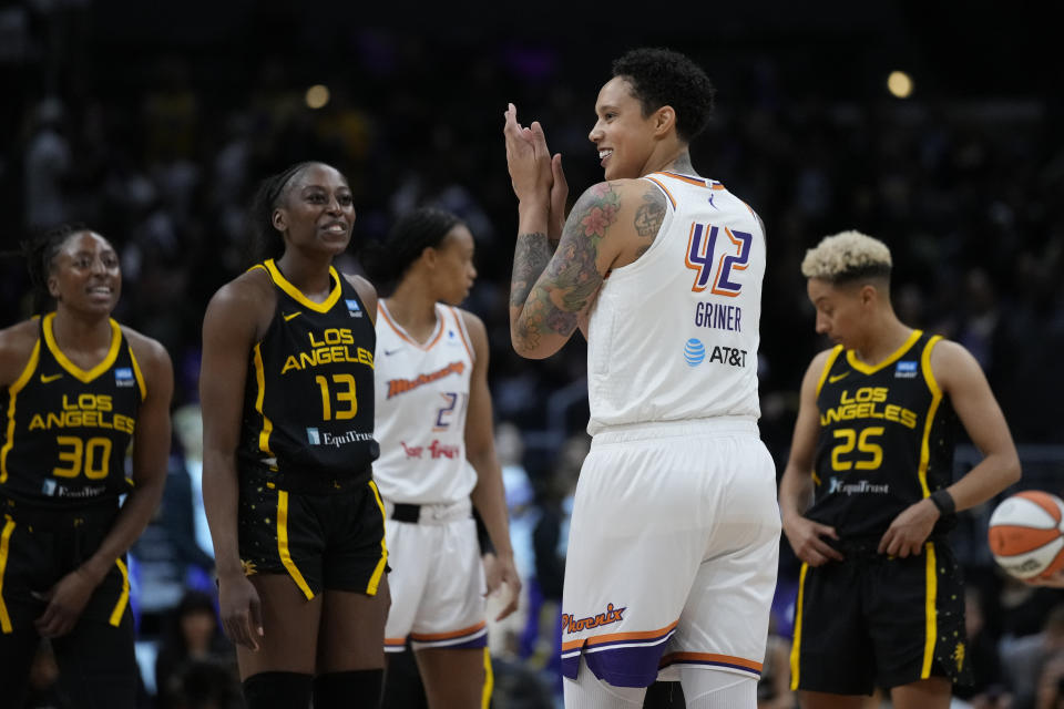 Phoenix Mercury center Brittney Griner (42) applauds on the court before a WNBA basketball game against the Los Angeles Sparks in Los Angeles, Friday, May 19, 2023. (AP Photo/Ashley Landis)