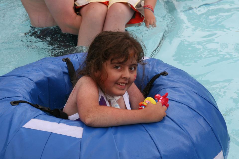 Megan Parker swims during a summer camp for children with breathing issues that's sponsored by Akron Children's Hospital and other area hospitals.