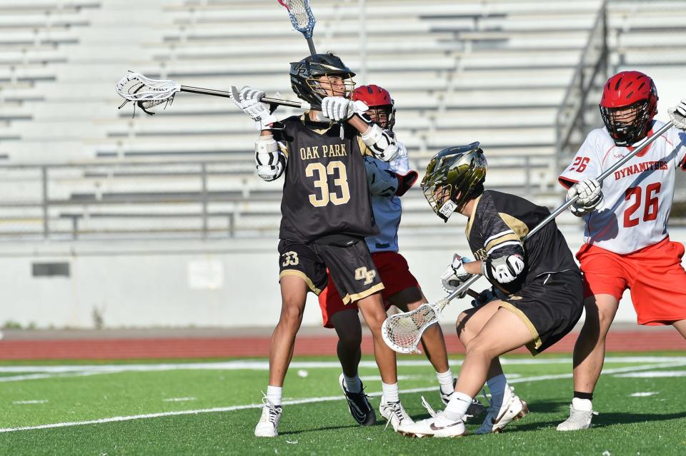 Oak Park's Jayden Mehta looks for a teammate during the Eagles' 19-1 win over Glendale on Tuesday, April 9, 2024. Mehta had three goals and two assists to help Oak Park win its seventh straight game.