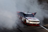 KANSAS CITY, KS - OCTOBER 08: Brad Keselowski, driver of the #22 Discount Tire Dodge, celebrates with a burnout after winning the NASCAR Nationwide Series Kansas Lottery 300 at Kansas Speedway on October 8, 2011 in Kansas City, Kansas. (Photo by Jamie Squire/Getty Images)