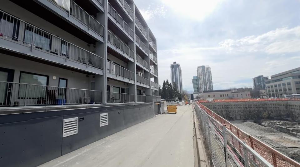 The UBC Properties Trust construction site is just meters away from a subsidized housing apartment complex, which has now been evacuated because of safety concerns in the building.