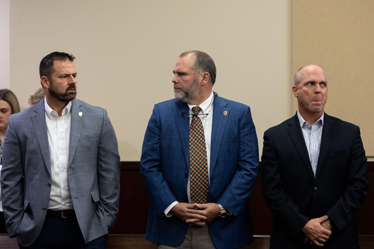 State Attorney Jack Campbell, center, talks with Jason Newlin, left, as they wait with Pat Sanford for the verdict in the Charlie Adelson trial to be read on Monday, Nov. 6, 2023.