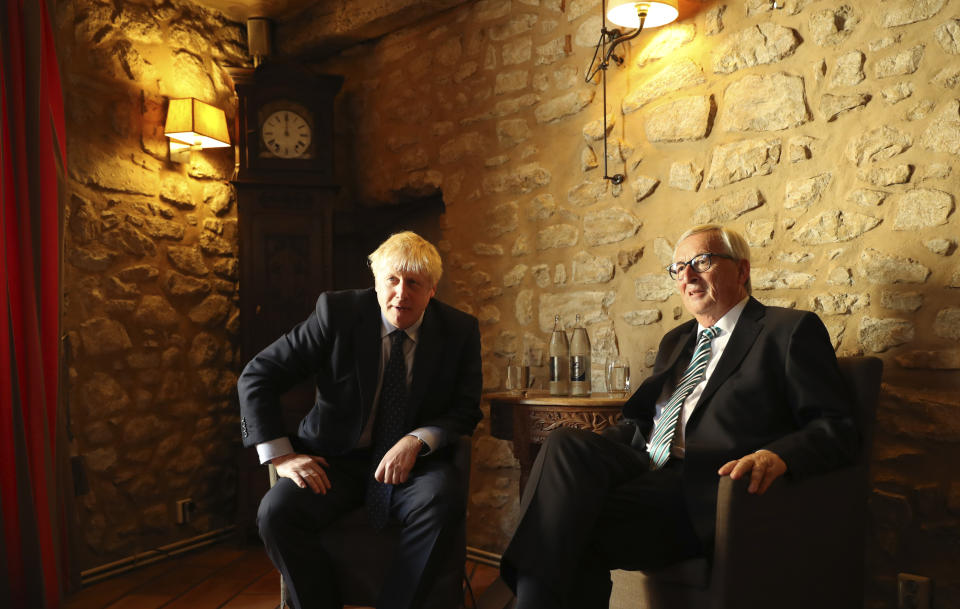 European Commission President Jean-Claude Juncker, right, poses with British Prime Minister Boris Johnson prior to a meeting at a restaurant in Luxembourg, Monday, Sept. 16, 2019. British Prime Minister Boris Johnson was holding his first meeting with European Commission President Jean-Claude Juncker on Monday in search of a longshot Brexit deal. (AP Photo/Francisco Seco, Pool)