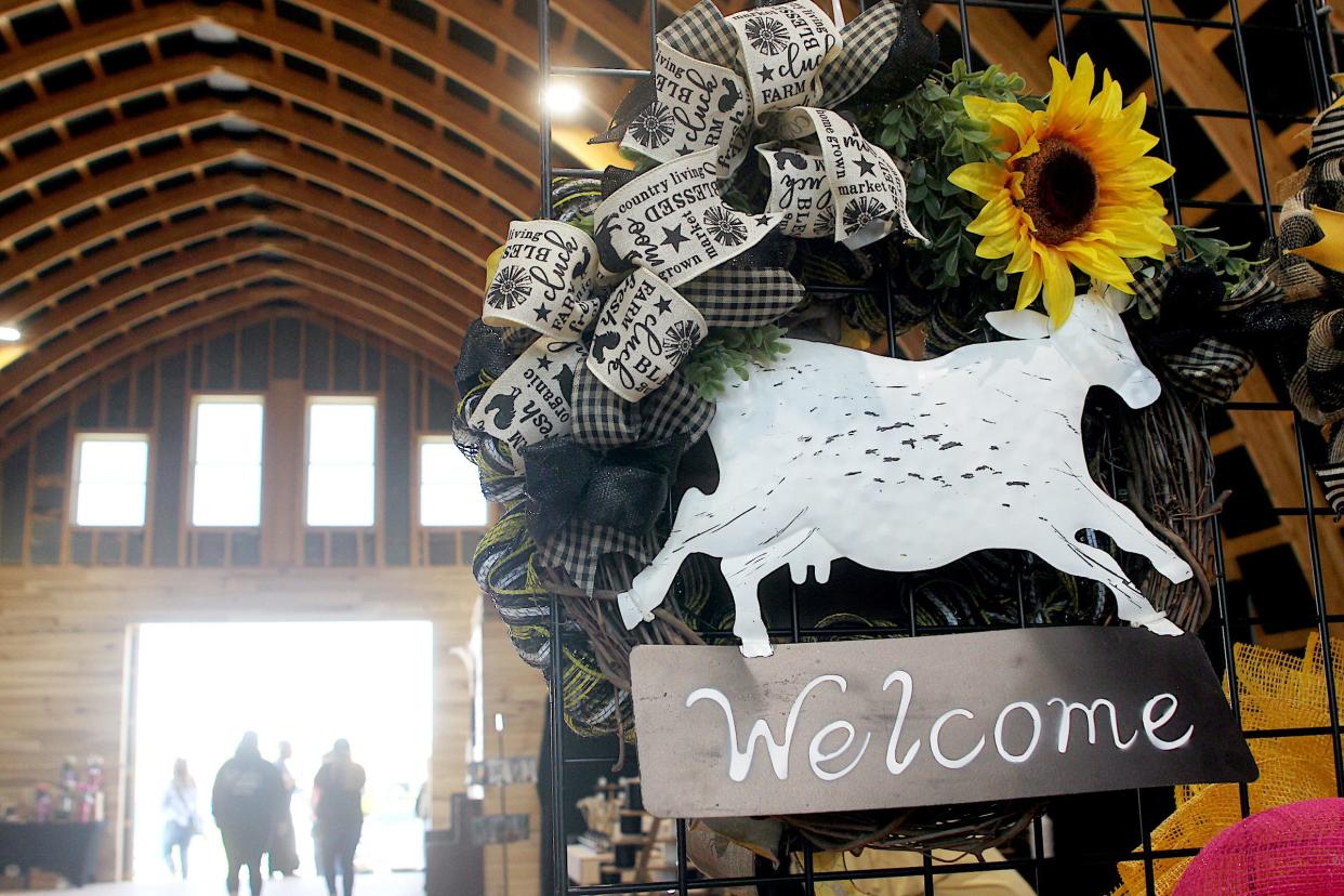 A wreath from Country Door Wreath Boutique is on display in the new barn at Lambrecht Farms on Saturday, May 11, 2024, during the two-day Sunflower Market.