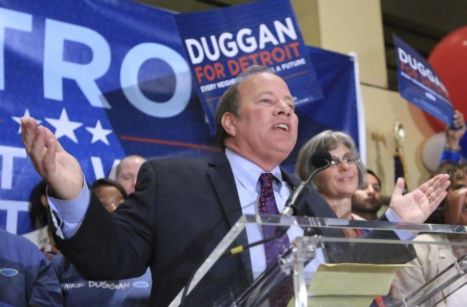 Detroit mayoral write-in candidate Mike Duggan takes the stage to talk with excited supporters after favorable primary election results during a party at the Atheneum Hotel in Detroit on Aug. 6, 2013.
