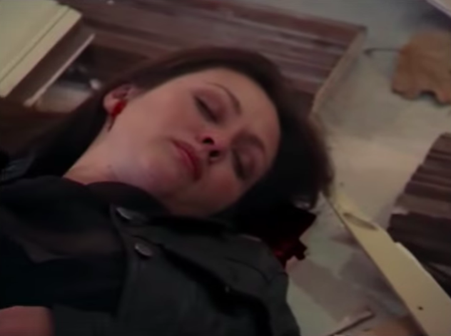 Prue lying on the ground after being attacked by a demon on "Charmed"